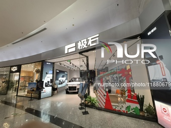 ROX new energy vehicles are displayed at Jinyuan Shopping Center, Beijing's largest shopping and leisure complex, in Beijing, China, on Dece...