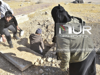 Another mass grave is uncovered in the Baghdad Bridge area of the Syrian capital Damascus on December 18, 2024, in Damascus, Syria. (