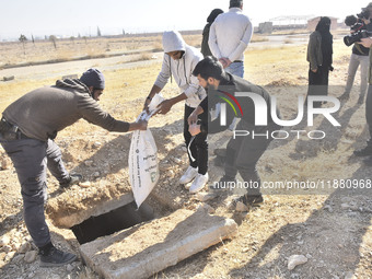 Another mass grave is uncovered in the Baghdad Bridge area of the Syrian capital Damascus on December 18, 2024, in Damascus, Syria. (