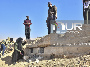 Another mass grave is uncovered in the Baghdad Bridge area of the Syrian capital Damascus on December 18, 2024, in Damascus, Syria. (