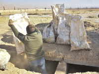 Another mass grave is uncovered in the Baghdad Bridge area of the Syrian capital Damascus on December 18, 2024, in Damascus, Syria. (