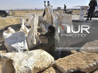 Another mass grave is uncovered in the Baghdad Bridge area of the Syrian capital Damascus on December 18, 2024, in Damascus, Syria. (