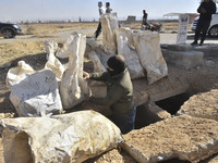 Another mass grave is uncovered in the Baghdad Bridge area of the Syrian capital Damascus on December 18, 2024, in Damascus, Syria. (