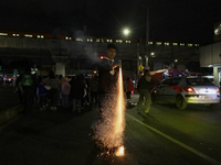 Residents of the town of Culhuacan in Mexico City, on December 18, 2024,  walk on a vehicular bridge while participating in a posada on Chri...