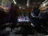 Residents of the town of Culhuacan in Mexico City, on December 18, 2024,  walk on a vehicular bridge while participating in a posada on Chri...