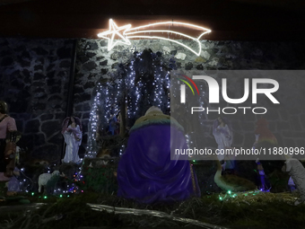 Residents of the town of Culhuacan in Mexico City, on December 18, 2024,  walk on a vehicular bridge while participating in a posada on Chri...