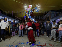 Residents of the town of Culhuacan in Mexico City, on December 18, 2024,  walk on a vehicular bridge while participating in a posada on Chri...