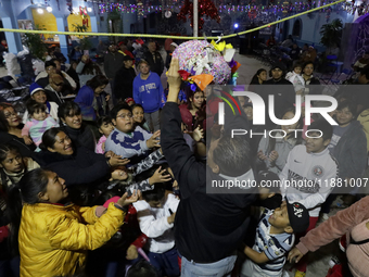 Residents of the town of Culhuacan in Mexico City, on December 18, 2024,  walk on a vehicular bridge while participating in a posada on Chri...