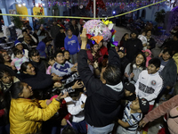 Residents of the town of Culhuacan in Mexico City, on December 18, 2024,  walk on a vehicular bridge while participating in a posada on Chri...