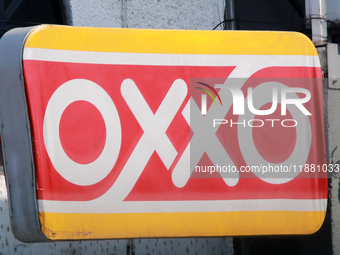 The logo of the Mexican convenience store company OXXO is on a facade in Mexico City, Mexico, on December 18, 2024. (