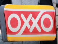 The logo of the Mexican convenience store company OXXO is on a facade in Mexico City, Mexico, on December 18, 2024. (