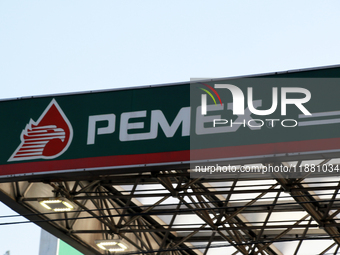 The logo of the Mexican state-owned oil company Petroleos Mexicanos (PEMEX) appears on the facade of a gas station in Mexico City, Mexico, o...