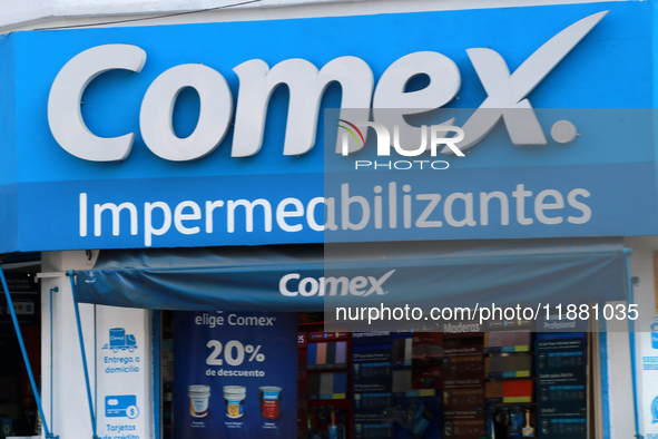 The logo of the Mexican architectural, industrial, and specialized paints and coatings company Comex is seen on a facade of the same company...