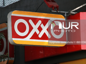 The logo of the Mexican convenience store company OXXO is on a facade in Mexico City, Mexico, on December 18, 2024. (