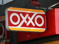 The logo of the Mexican convenience store company OXXO is on a facade in Mexico City, Mexico, on December 18, 2024. (