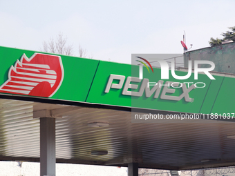 The logo of the Mexican state-owned oil company Petroleos Mexicanos (PEMEX) appears on the facade of a gas station in Mexico City, Mexico, o...