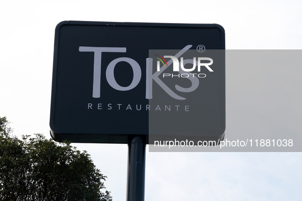 The logo of the Mexican family restaurant company Toks is seen in Mexico City, Mexico, on December 18, 2024. 