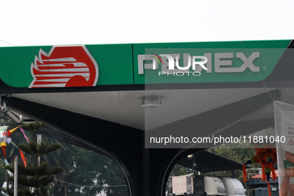 The logo of the Mexican state-owned oil company Petroleos Mexicanos (PEMEX) appears on the facade of a gas station in Mexico City, Mexico, o...