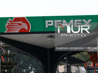 The logo of the Mexican state-owned oil company Petroleos Mexicanos (PEMEX) appears on the facade of a gas station in Mexico City, Mexico, o...