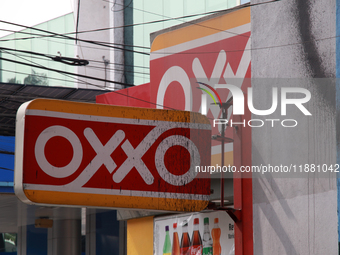 The logo of the Mexican convenience store company OXXO is on a facade in Mexico City, Mexico, on December 18, 2024. (