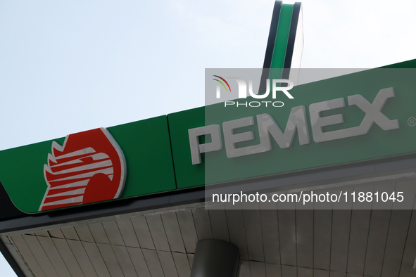 The logo of the Mexican state-owned oil company Petroleos Mexicanos (PEMEX) appears on the facade of a gas station in Mexico City, Mexico, o...