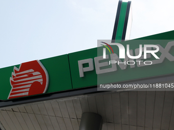 The logo of the Mexican state-owned oil company Petroleos Mexicanos (PEMEX) appears on the facade of a gas station in Mexico City, Mexico, o...