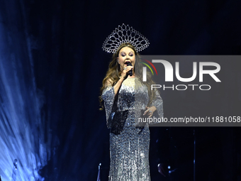 British singer Sarah Brightman performs on stage during the A Christmas Symphony Holiday Tour at Mexico City Arena in Mexico City, Mexico, o...