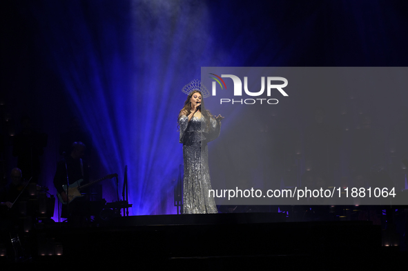 British singer Sarah Brightman performs on stage during the A Christmas Symphony Holiday Tour at Mexico City Arena in Mexico City, Mexico, o...