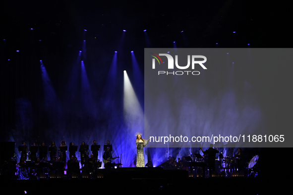 British singer Sarah Brightman performs on stage during the A Christmas Symphony Holiday Tour at Mexico City Arena in Mexico City, Mexico, o...