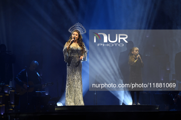 British singer Sarah Brightman and Sofia Escoto perform on stage during the A Christmas Symphony Holiday Tour at Mexico City Arena in Mexico...