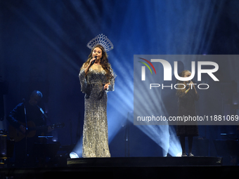 British singer Sarah Brightman and Sofia Escoto perform on stage during the A Christmas Symphony Holiday Tour at Mexico City Arena in Mexico...