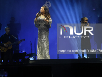 British singer Sarah Brightman and Sofia Escoto perform on stage during the A Christmas Symphony Holiday Tour at Mexico City Arena in Mexico...