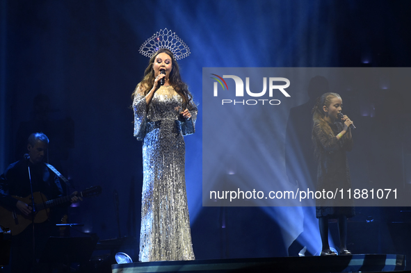 British singer Sarah Brightman and Sofia Escoto perform on stage during the A Christmas Symphony Holiday Tour at Mexico City Arena in Mexico...