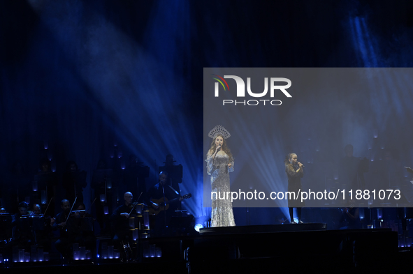 British singer Sarah Brightman and Sofia Escoto perform on stage during the A Christmas Symphony Holiday Tour at Mexico City Arena in Mexico...