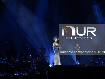 British singer Sarah Brightman and Sofia Escoto perform on stage during the A Christmas Symphony Holiday Tour at Mexico City Arena in Mexico...