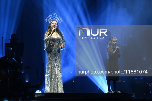 British singer Sarah Brightman and Sofia Escoto perform on stage during the A Christmas Symphony Holiday Tour at Mexico City Arena in Mexico...