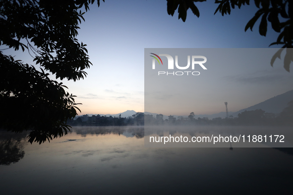 Vapor rises from the Taudaha wetland on the outskirts of Kathmandu, Nepal, on December 19, 2024. 