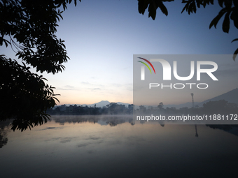 Vapor rises from the Taudaha wetland on the outskirts of Kathmandu, Nepal, on December 19, 2024. (