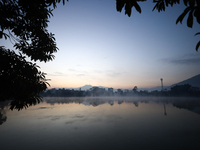 Vapor rises from the Taudaha wetland on the outskirts of Kathmandu, Nepal, on December 19, 2024. (