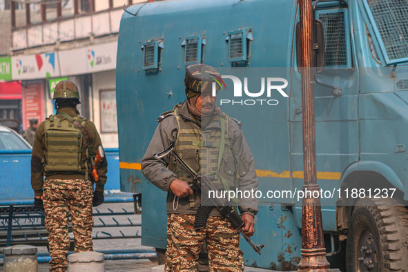 An Indian security personnel stands guard along a road in Srinagar, Jammu and Kashmir, on December 19, 2024. Indian security forces kill fiv...