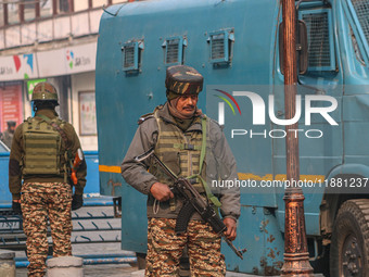 An Indian security personnel stands guard along a road in Srinagar, Jammu and Kashmir, on December 19, 2024. Indian security forces kill fiv...