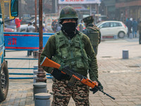 An Indian security personnel stands guard along a road in Srinagar, Jammu and Kashmir, on December 19, 2024. Indian security forces kill fiv...