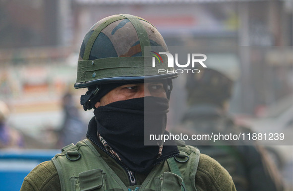 An Indian security personnel stands guard along a road in Srinagar, Jammu and Kashmir, on December 19, 2024. Indian security forces kill fiv...