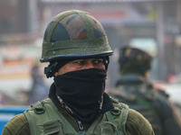 An Indian security personnel stands guard along a road in Srinagar, Jammu and Kashmir, on December 19, 2024. Indian security forces kill fiv...