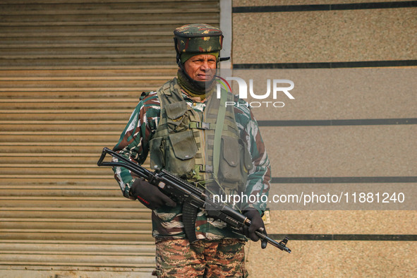 An Indian security personnel stands guard along a road in Srinagar, Jammu and Kashmir, on December 19, 2024. Indian security forces kill fiv...