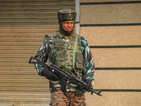 An Indian security personnel stands guard along a road in Srinagar, Jammu and Kashmir, on December 19, 2024. Indian security forces kill fiv...