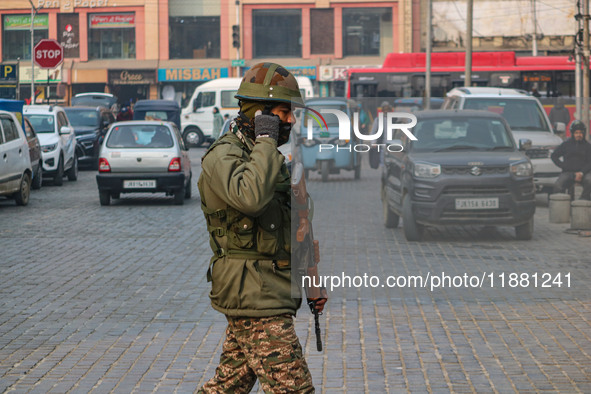 An Indian security personnel guards along a road in Srinagar, Jammu and Kashmir, on December 19, 2024. Indian security forces kill five mili...