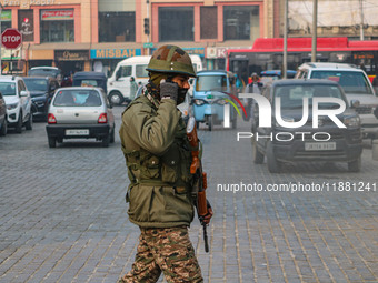 An Indian security personnel guards along a road in Srinagar, Jammu and Kashmir, on December 19, 2024. Indian security forces kill five mili...