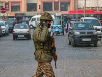 An Indian security personnel guards along a road in Srinagar, Jammu and Kashmir, on December 19, 2024. Indian security forces kill five mili...