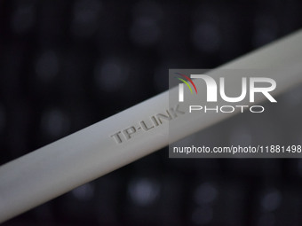 The logo of TP-Link appears on the products of router manufacturer TP-Link in Fuyang, China, on December 19, 2024. (